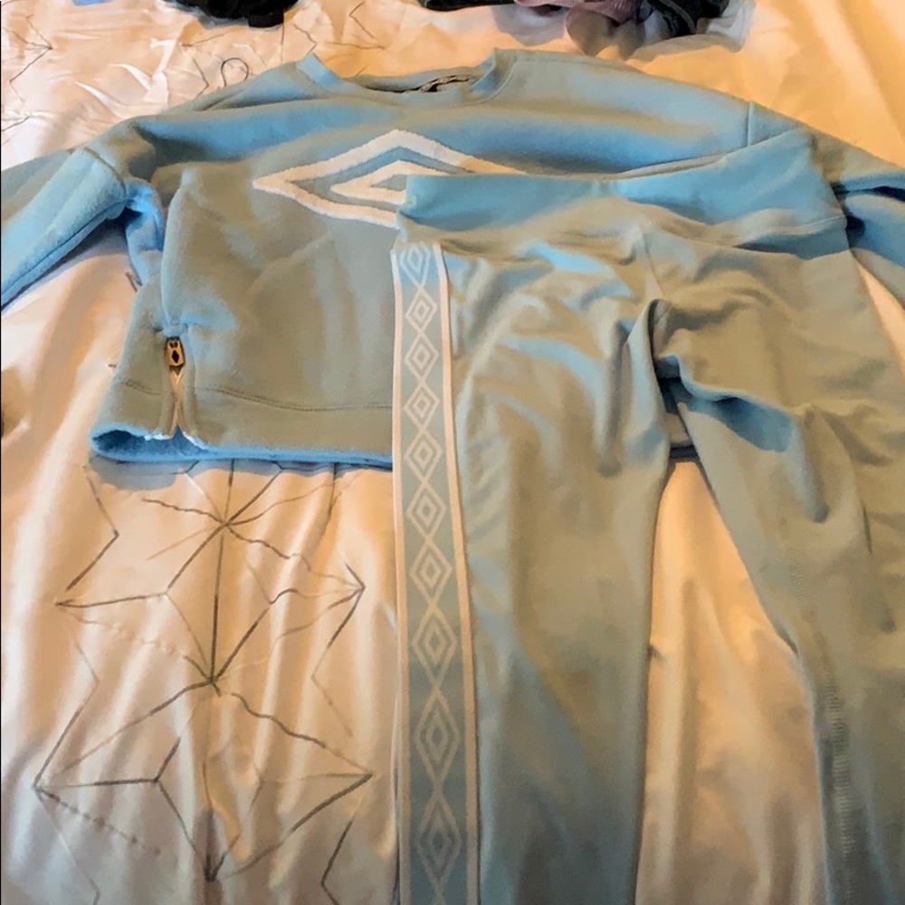 A blue sweatshirt and blue pants